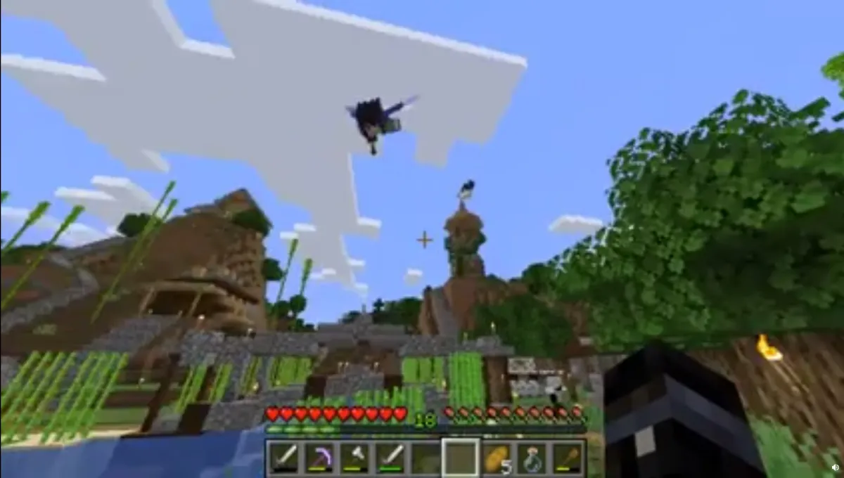 Player flying through the air using Elytra in Minecraft.
