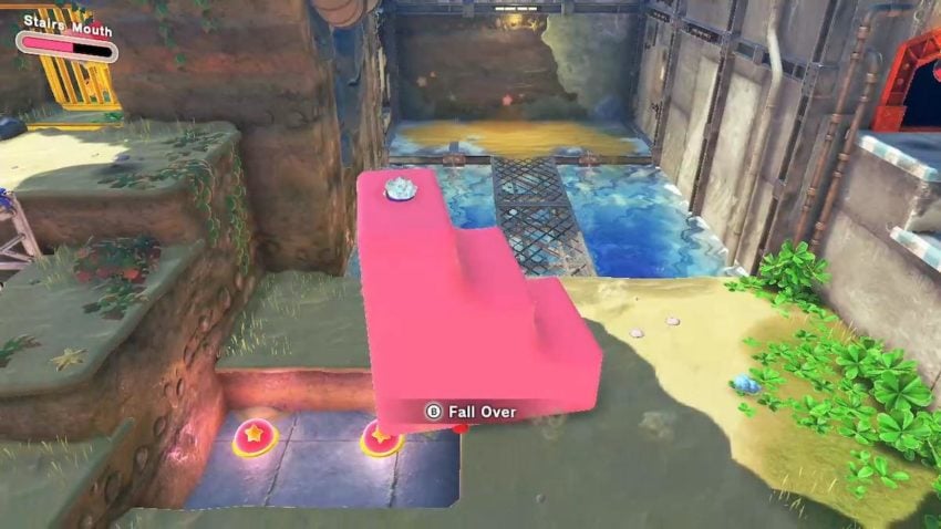 Kirby, while possessing a set of stairs, moves on top of some switches