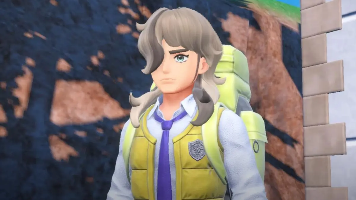 Arven in Pokémon Scarlet and Violet. He has long, light-colored hair that covers one of his eyes, and a bright vest.