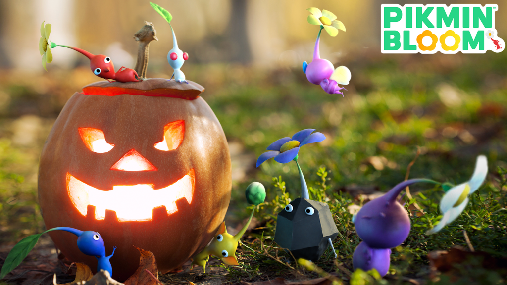A group of Pikmin of varying types frolic in front of a somewhat friendly looking Jack-O'-Lantern.