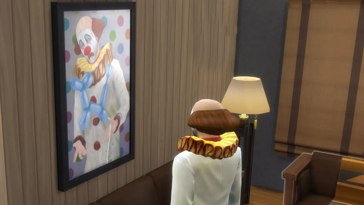 A Tragic Clown stares forlornly at a portrait of another Tragc Clown.