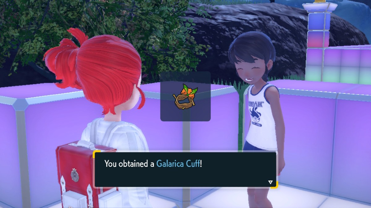 Pokemon Indigo Disk screenshot of a player character obtaining the Galarica Cuff item from an NPC.