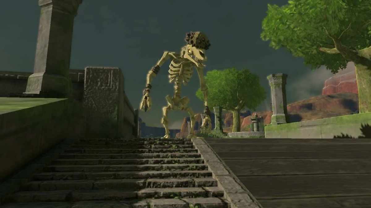 A Stalmoblin, a human-like skeleton with a horse-like skull, stands at the top of a flight of darkened stone stairs. it appears to be in the ruins of an ancient building.