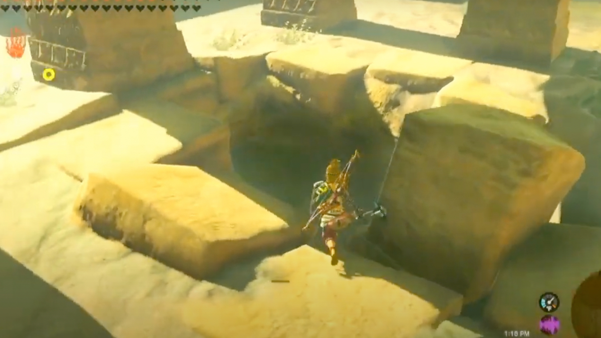 Link goes charging towards a very a large hole in the stone of an ancient ruin.