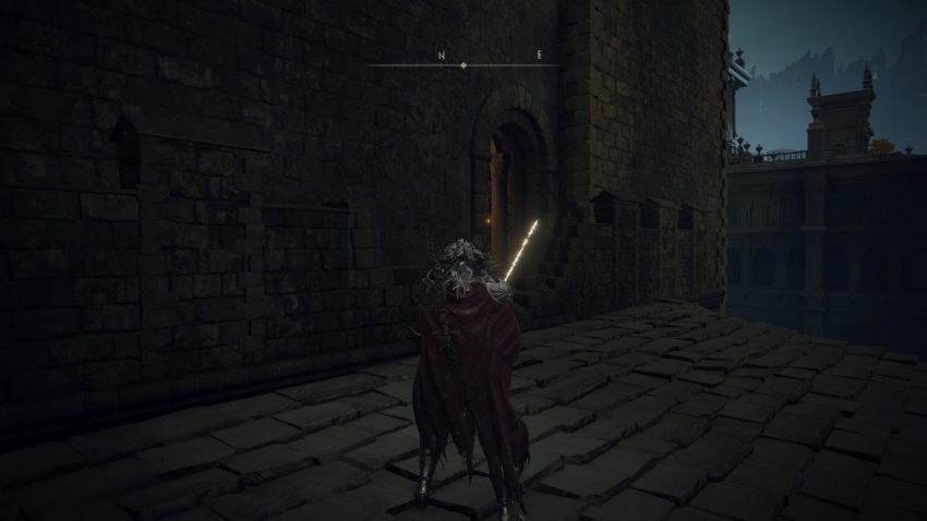 Screenshot of Elden Ring showing a doorway leading into a building