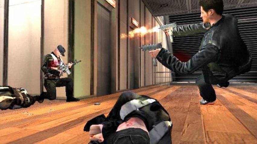 Max Payne shooting military personnel with two Uzis.