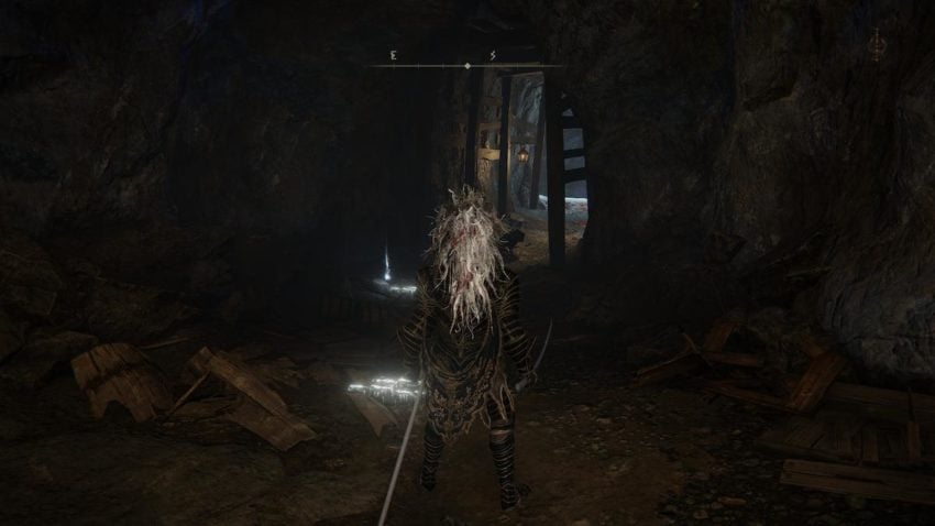 Screenshot of Elden Ring showing a hidden path in a cave.