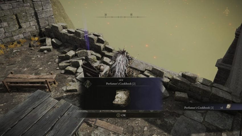 Screenshot of Elden Ring showing the Tarnished picking up the Perfumer's Cookbook 2 from a dead body