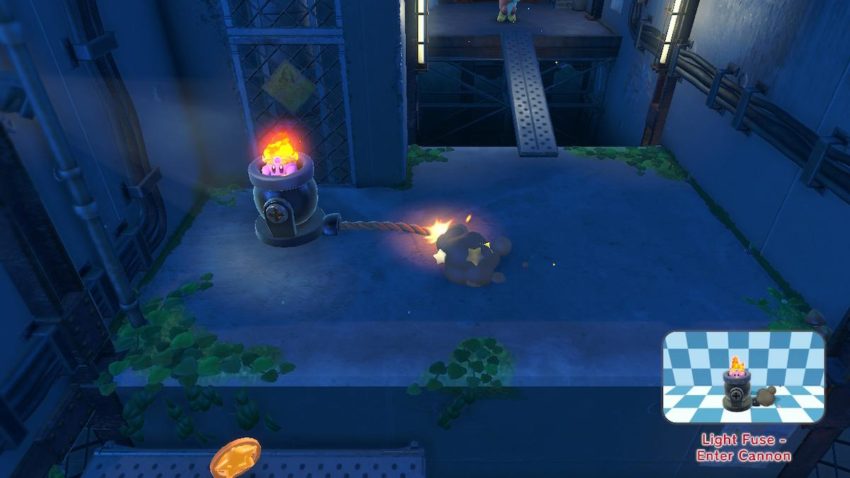 Kirby sits inside of a cannon