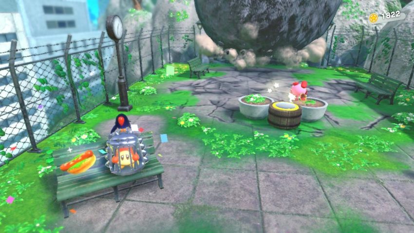 Kirby runs from a boulder and hits a switch to reveal a Waddle Dee