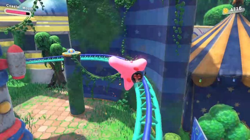 Kirby rides a rollercoaster towards a switch