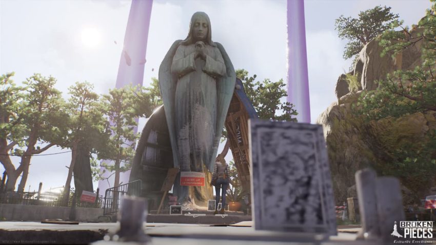 Elise stands before a large shine of an angel. Sentimental pictures and protest signs surround the shrine.