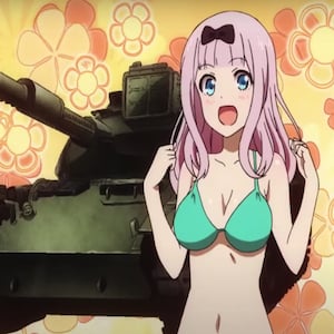 Chika in bikini next to a tank