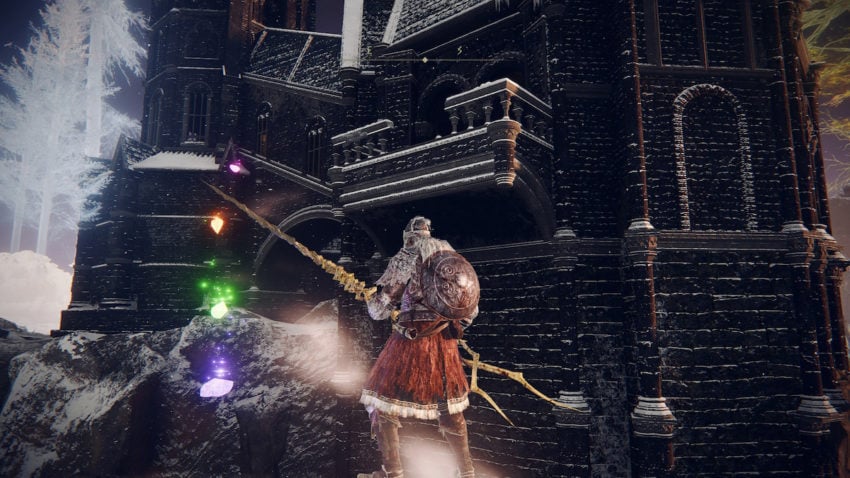 Elden Ring screenshot of a player character standing on the "falling snow marks something unseen invisible bridge with rainbow stones leading up an invisible staircase